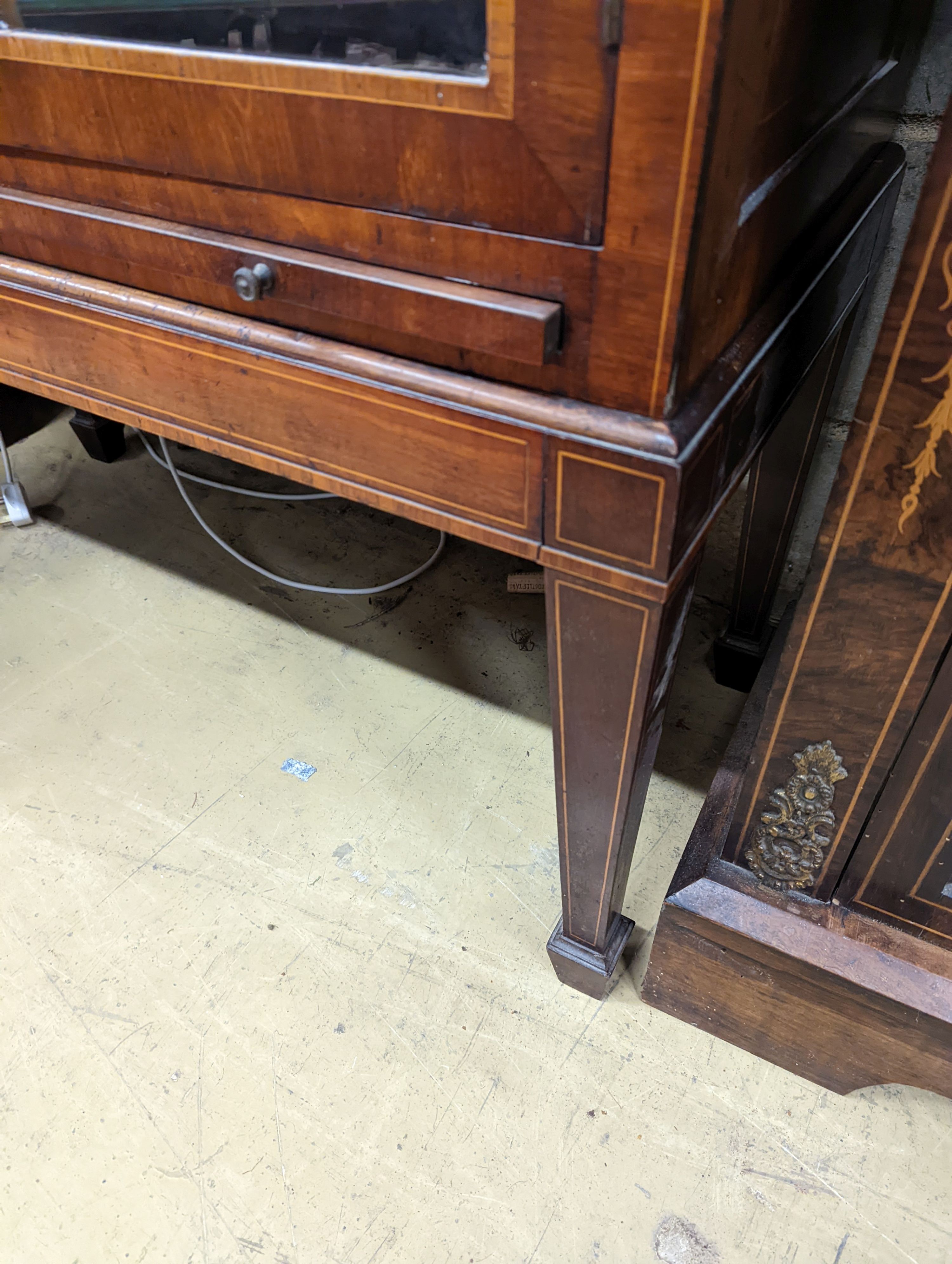 A George III style mahogany and tulipwood banded, domed topped china display cabinet, raised on a stand, width 87cm, depth 39cm, height 225cm